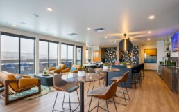 The GW Apartments resident lounge featuring the interior space with spectacular mountain views