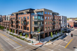 An aerial view of the Riverwalk Luxe Building exterior from the corner